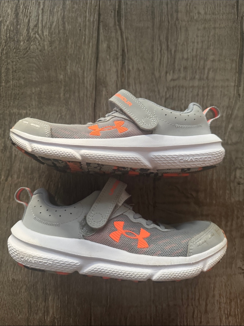 Under Armour Kids Gray Sneakers with Neon Orange Accents